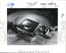 Sega Saturn Auction - 1995 Press Photo Sega Saturn Game Console